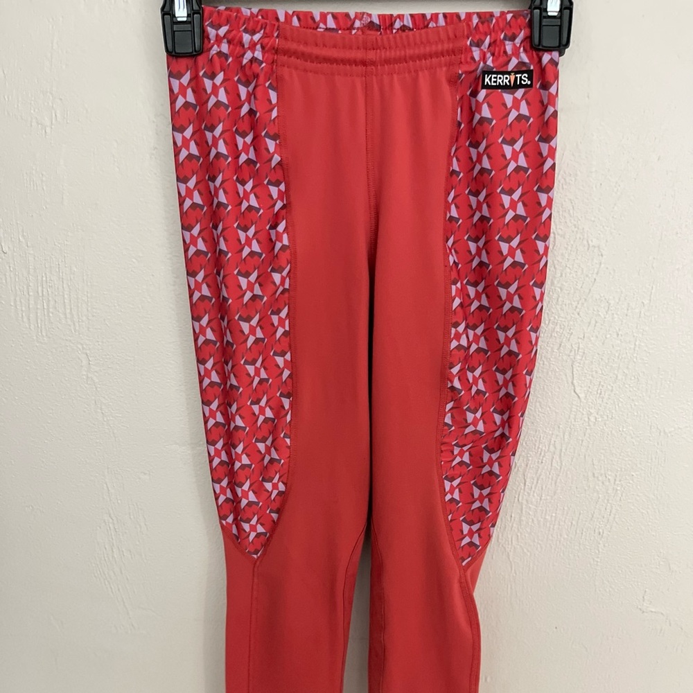 Children’s salmon large Kerrits knee patch riding tights. Equestrian kids